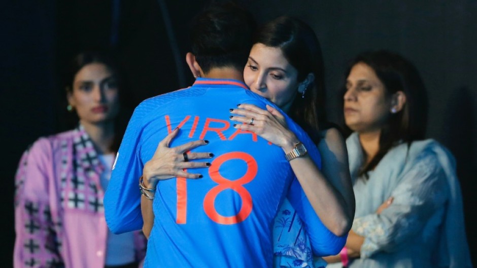 Bollywood actress Anushka Sharma hugs her husband, the Indian cricketer Virat Kohli