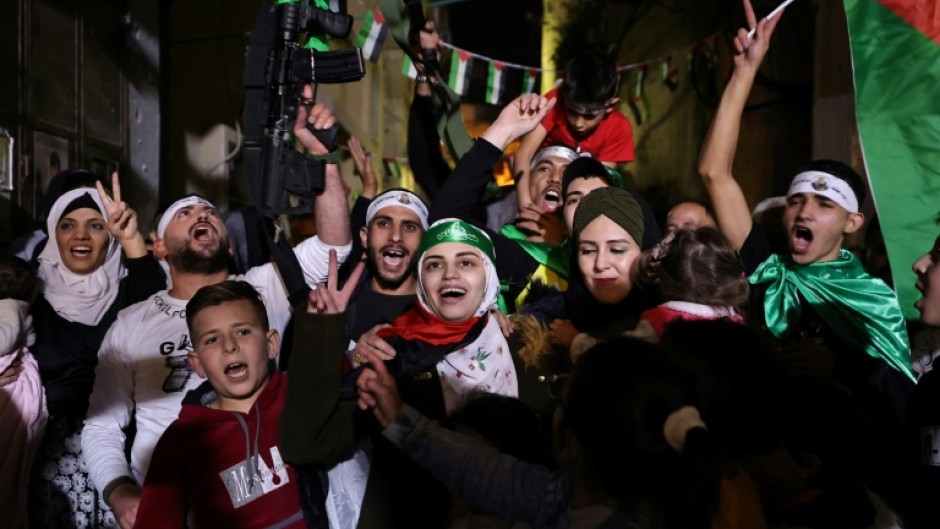 Asil al-Titi, a 23-year-old woman from the occupied West Bank Balata refugee camp, is greeted by friends and family members, shortly after she was released from an Israeli jail, late on November 24, 2023