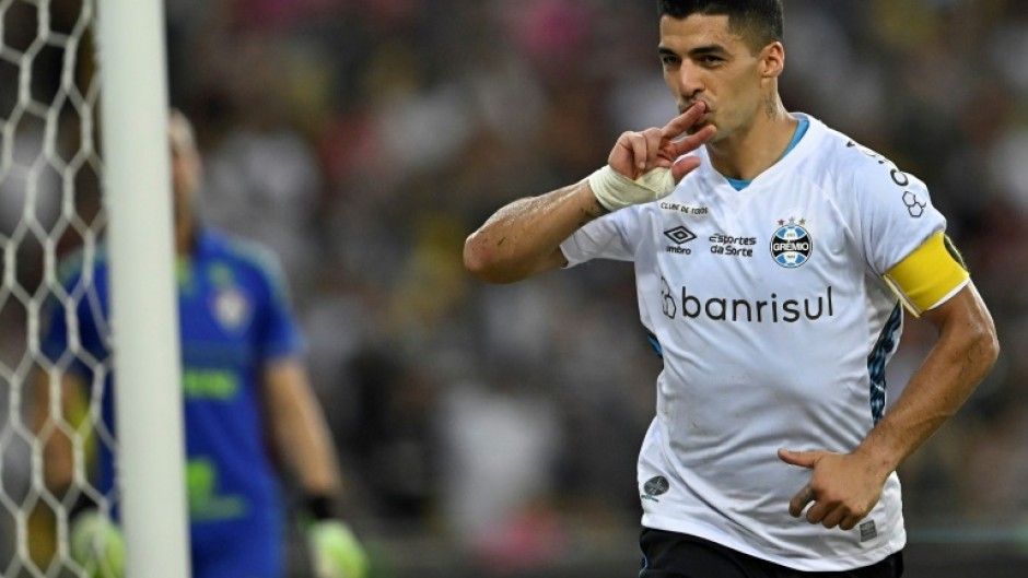 Luis Suarez celebrates after scoring the second of two goals in his farewell appearance for Gremio in a 3-2 win over Fluminense at the Maracana Stadium