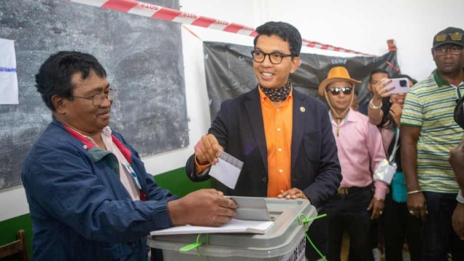 President Andry Rajoelina casts his ballot in Madagascar's national election clouded by opposition protests