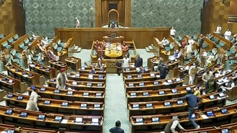 The suspended MPs had called for a debate over the December 13 incident when a man (bottom R) jumped down from a visitors' gallery and a smoke canister was released