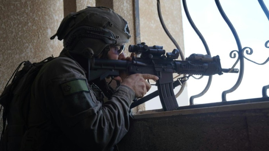 This handout picture released by the Israeli army on December 21, 2023 shows a soldier operating in the Gaza Strip