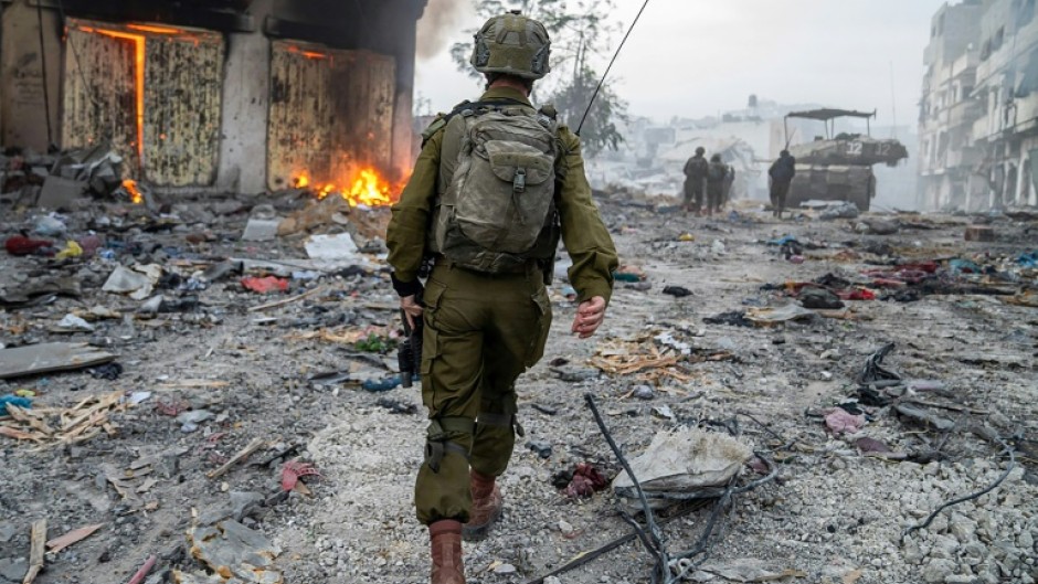 Israeli soldiers operate in the Gaza Strip, in a picture released by the army on December 22, 2023 