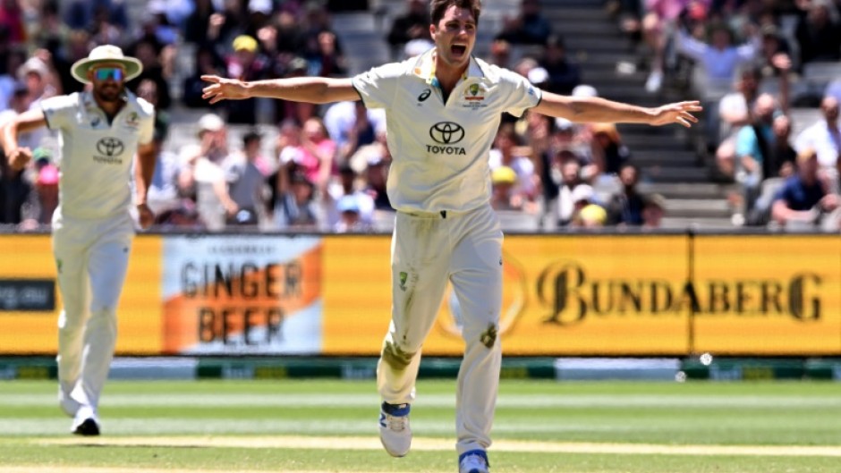 Australian bowler Pat Cummins (C) celebrates another wicket against Pakistan