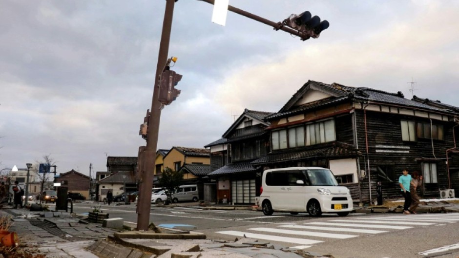 Pavement was left cracked on a street in the city of Wajima after the quake