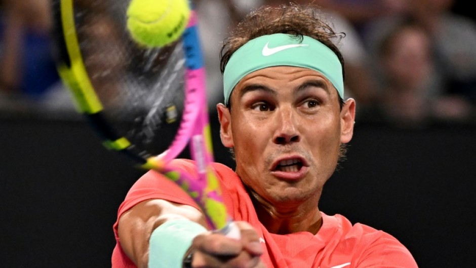 Spain's Rafael Nadal hits a return against Austria's Dominic Thiem at the Brisbane International