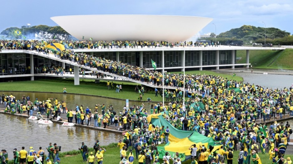 Supporters of Brazilian former President Jair Bolsonaro demonstrate at the Esplanada dos Ministerios in Brasilia on January 8, 2023