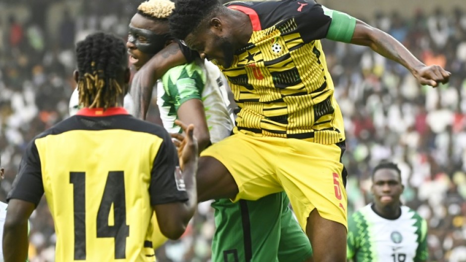 Nigeria star Victor Osimhen (2L) in an aerial clash during a 2022 World Cup qualifier against Ghana in Abuja.