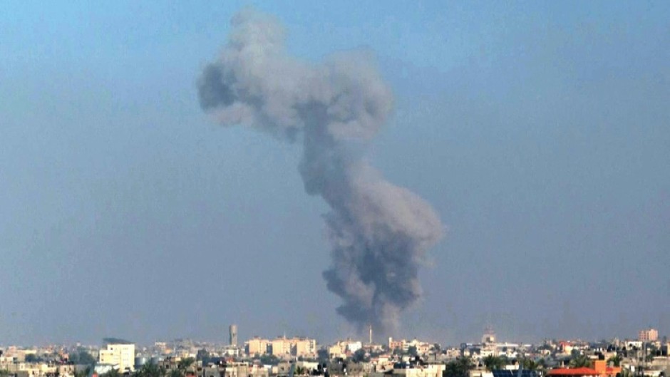 Smoke billows following Israeli strikes on Khan Yunis, seen from Rafah