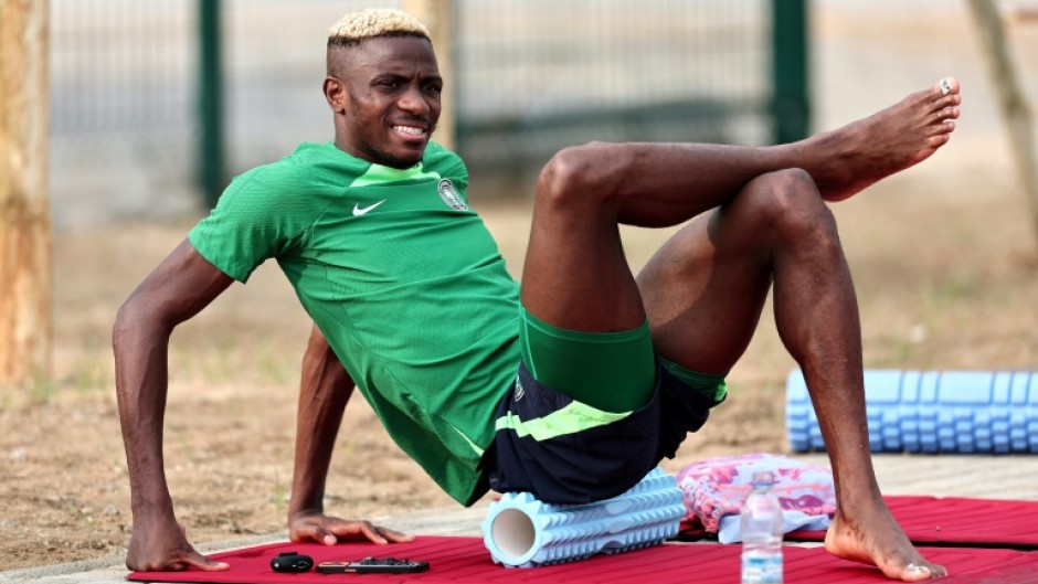 Napoli striker Osimhen does some stretches during a Nigerian training session in Abidjan on Monday