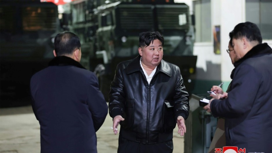 North Korean leader Kim Jong Un (C) has toured numerous weapons manufacturing facilities in recent months