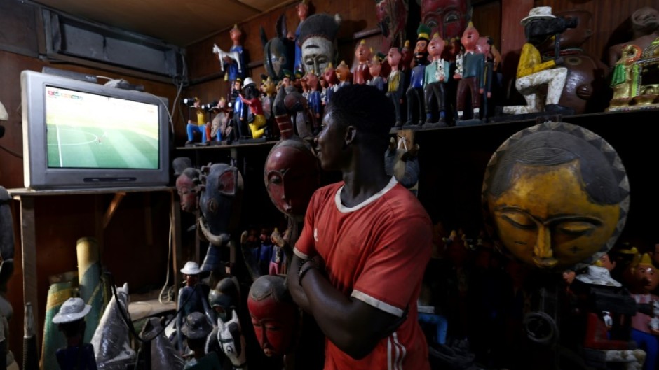 Secretary of State Antony Blinken is set to watch an Africa Cup of Nations match in Abidjan, where a vendor is seen watching on television on January 16, 2024