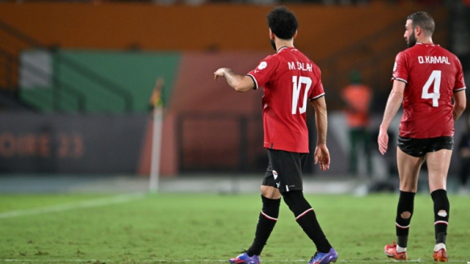 Egypt's Mohamed Salah walks off after picking up an injury against Ghana