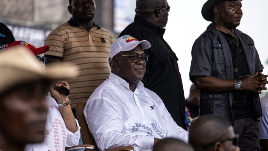 DR Congo President Felix Tshisekedi (C) officially swept the election to win a second term