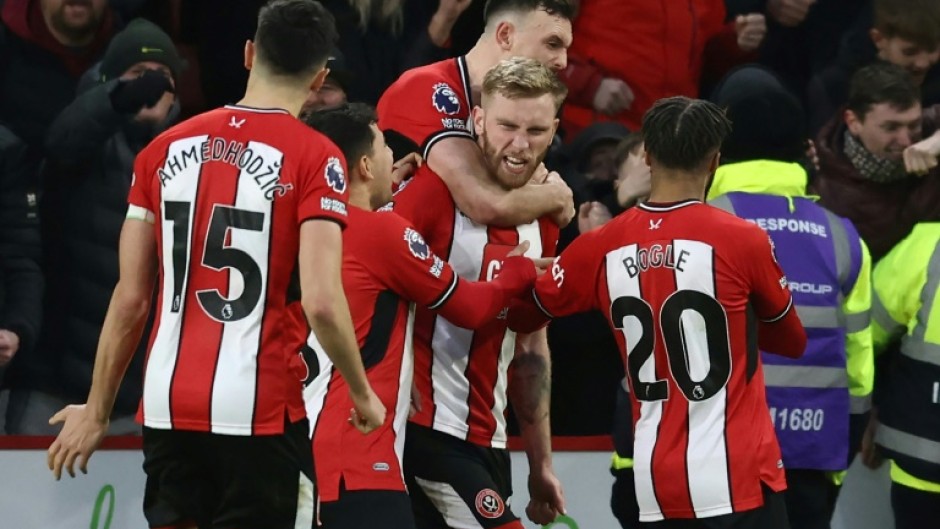 Oli McBurnie (centre) scored a 102st-minute penalty to salvage a 2-2 draw for Sheffield United