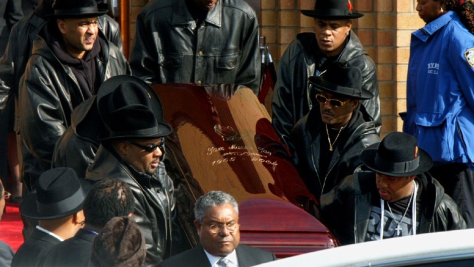 The coffin of Run-DMC's Jam Master Jay, the rapper born Jason Mizell, is carried out of a cathedral in Queens, New York, after his funeral in November 2002