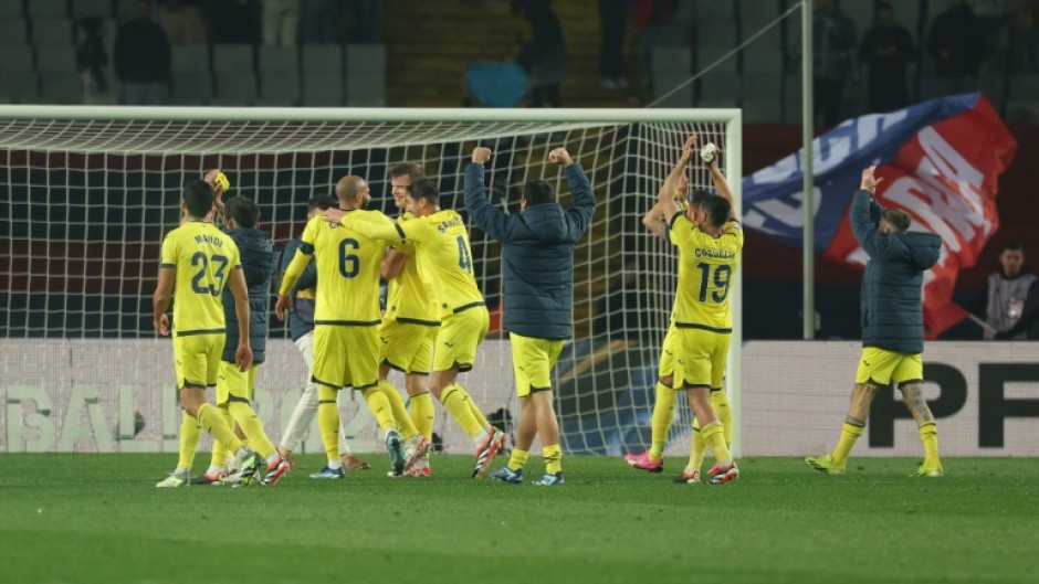 Villarreal's players celebrate their thrilling 5-3 victory over Barcelona in La Liga on Saturday at the Olympic Stadium