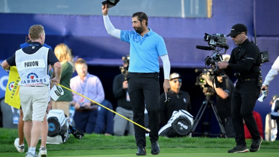 Matthieu Pavon of France waves to the crowd after winning the Farmers Insurance Open at Torrey Pines