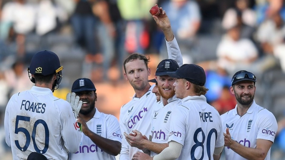 Tom Hartley (C) claimed seven wickets in India's second innings to help England to victory in the first Test in Hyderabad