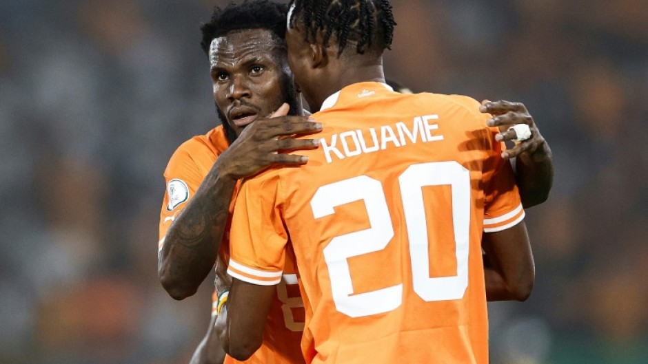 Franck Kessie (L) celebrates scoring for Ivory Coast with Christian Kouame.
