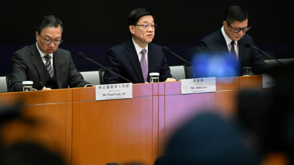 Hong Kong will create its own national security law "as soon as possible", city leader John Lee (C) said Tuesday