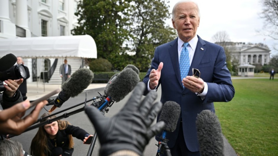 US President Joe Biden speaks to reporters before boarding Marine One on the South Lawn of the White House