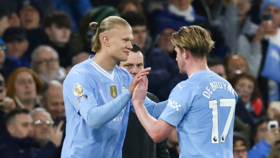 Erling Haaland (left) is ready to start after a two-month injury layoff, says Pep Guardiola