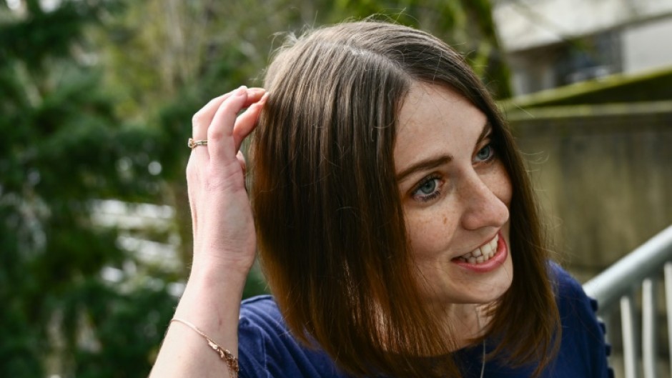 Amber Pearson, who received a brain implant to treat her epilepsy and Obsessive Compulsive disorder (OCD), shows the approximate placement of a brain implant received at the Oregon Health and Science University (OHSU) hospital in Portland, Oregon