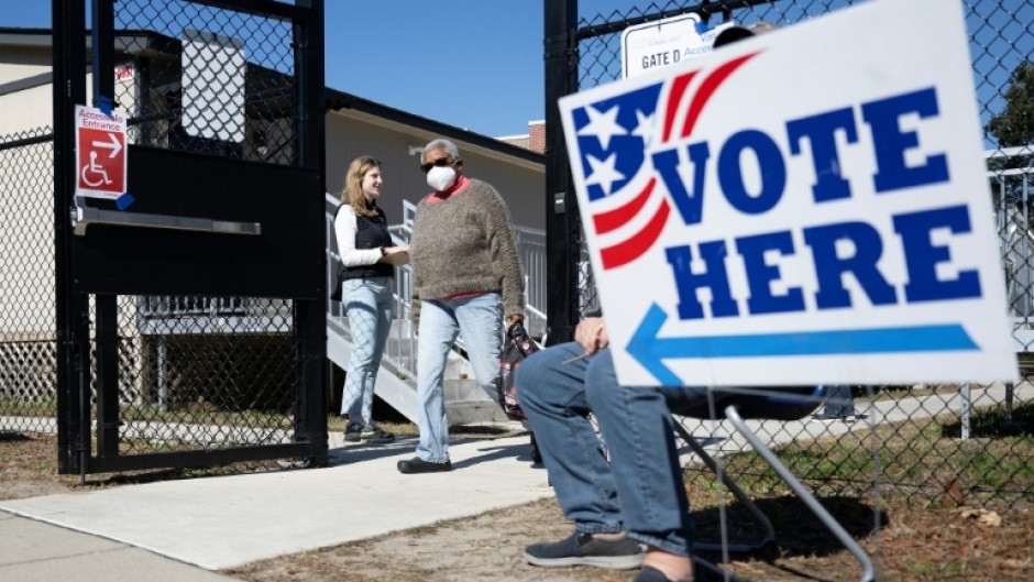 A woman departs a polling location at Stiles Point Elementary in Charleston, South Carolina during the Democratic primary