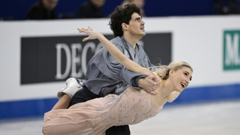 Sailing across the ice in billowing steel grey and baby pink, Gilles and Poirier wowed the crowd with their complex choreography 