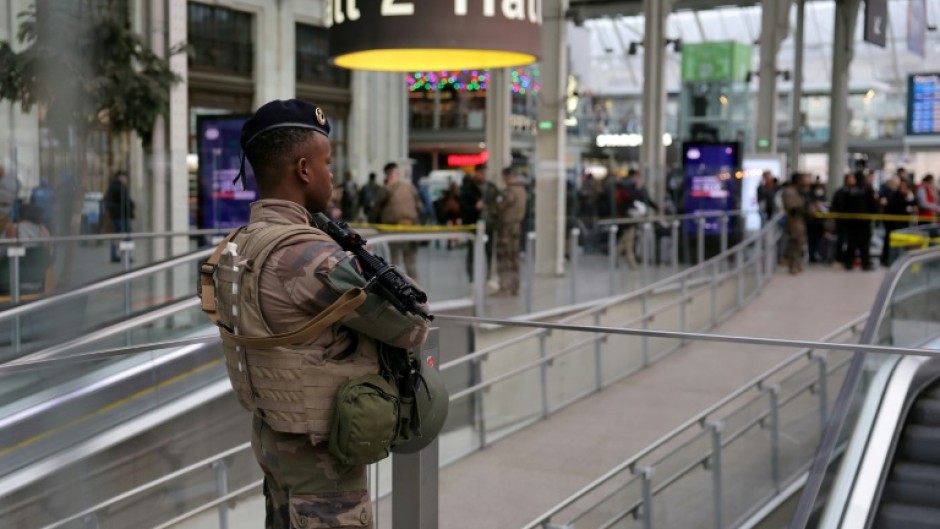 A French soldier stands guard after a knife attack at Paris's Gare de Lyon railway station