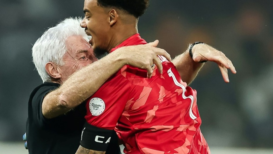 South Africa coach Hugo Broos embraces Ronwen Williams after the goalkeeper's heroics against Cape Verde took them through to the Africa Cup of Nations semi-finals