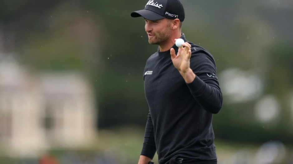 Wyndham Clark of the United States acknowledges the crowd after making the course record low score of 60 at the Pebble Beach Pro-Am on Saturday.