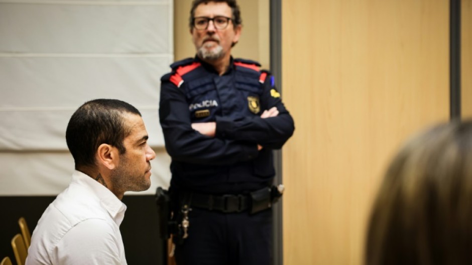 Dani Alves, seen here at the start of his trial for rape in Barcelona, could face a nine-year jail term if convicted