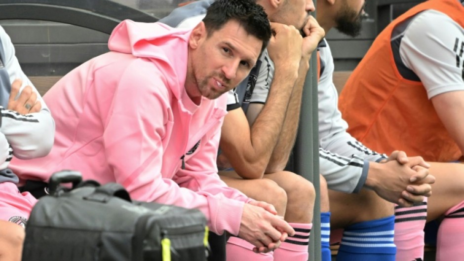 Lionel Messi sits on the bench during the friendly football between a Hong Kong XI and Inter Miami