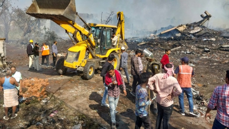 Flames reached high into the sky from the explosion at the fireworks factory, which destroyed entire buildings in a wide blast site