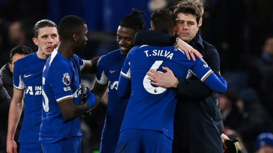 Chelsea boss Mauricio Pochettino (right) hugs defender Thiago Silva