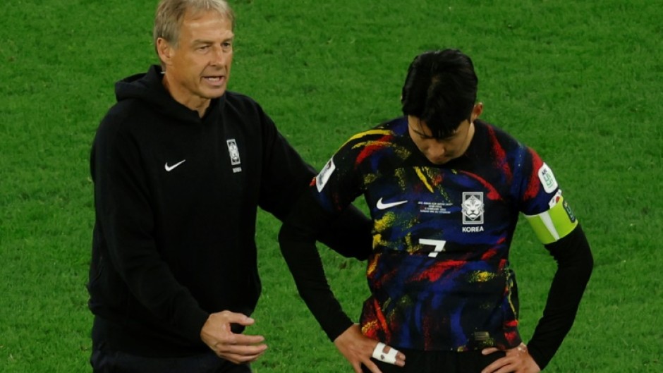 Jurgen Klinsmann and Son Heung-min after defeat in Qatar