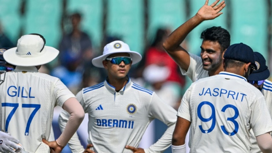 India's Ravichandran Ashwin celebrates after taking the wicket of England's Zak Crawley, his 500th Test wicket, during the second day of the third cricket Test in Rajkot