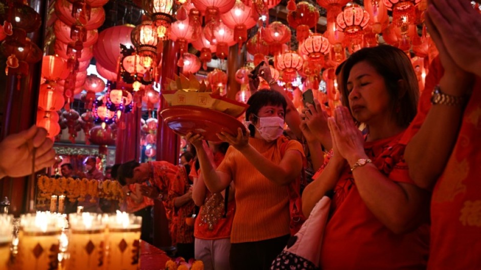 Millions of Thai-Chinese marked Lunar New Year with parties, family meals and visits to many of the shrines dotted around Chinatown