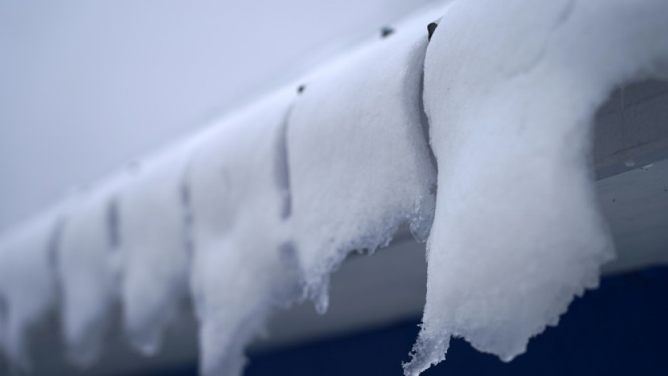 Snow melts on the roof of an ice fishing cabin in Sainte-Anne-de-la-Perade, Quebec, Canada in January 2024