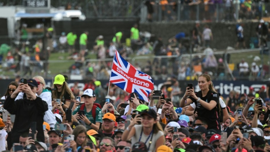 F1 fans watch the podium ceremony for the British Grand Prix at Silverstone