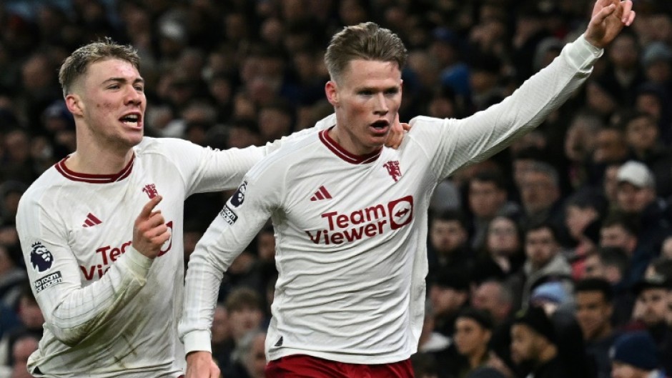 Manchester United's Scott McTominay (R) celebrates scoring the winner at Aston Villa