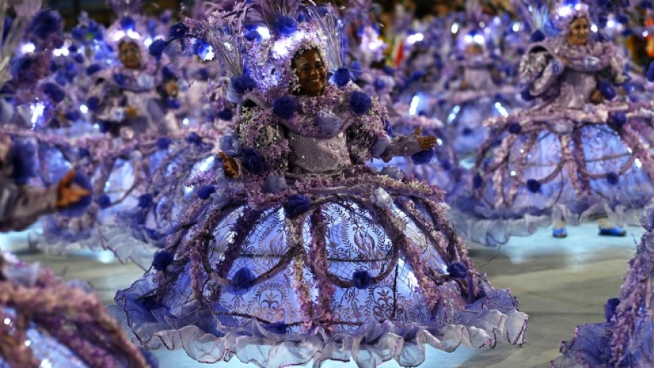 Members of the Porto da Pedra samba school perform during the first night of the Carnival parade at the Marques de Sapucai Sambadrome in Rio de Janeiro, Brazil on February 11, 2024