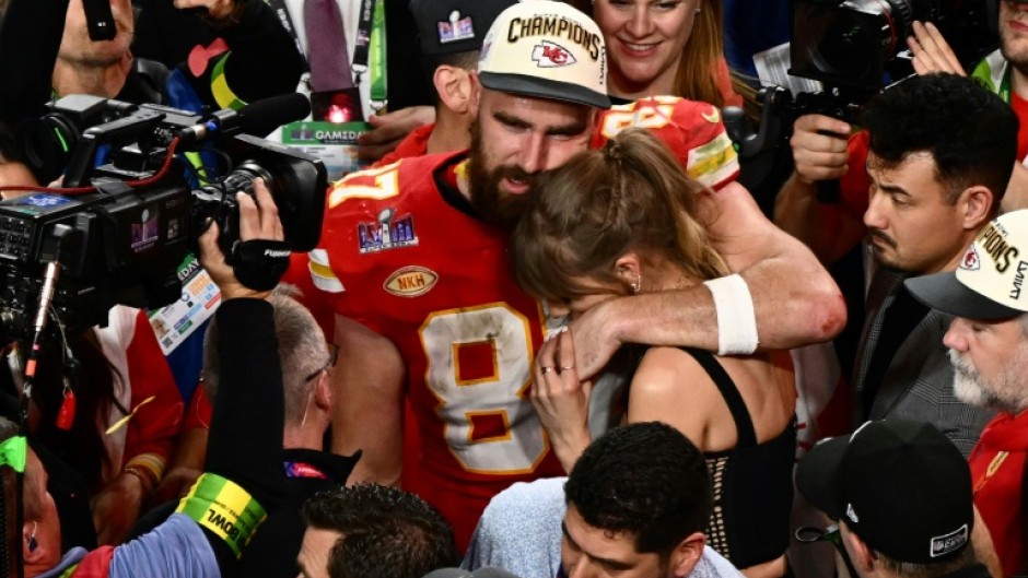 Taylor Swift and Kansas City Chiefs' tight end #87 Travis Kelce embrace after the Chiefs won Super Bowl LVIII against the San Francisco 49ers at Allegiant Stadium in Las Vegas, Nevada, in February 2024