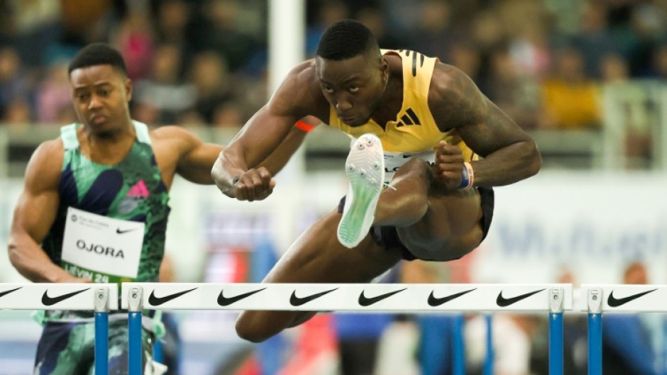 US sprint king Grant Holloway set a world record in the 60m hurdles at the US Indoor Championships on Friday