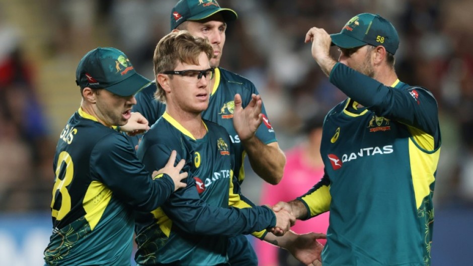 Australia's Adam Zampa celebrates the wicket of New Zealand’s Glenn Phillips