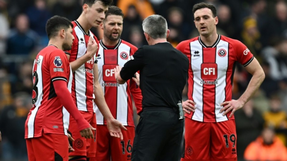 Jack Robinson (right) squared up to teammate Vinicius Souza (not pictured) during Sheffield United's 1-0 defeat at Wolves