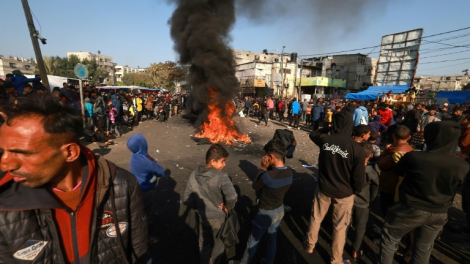 Palestinians burn tires in protest against the rising prices of food and supplies, in Gaza's Rafah refugee camp