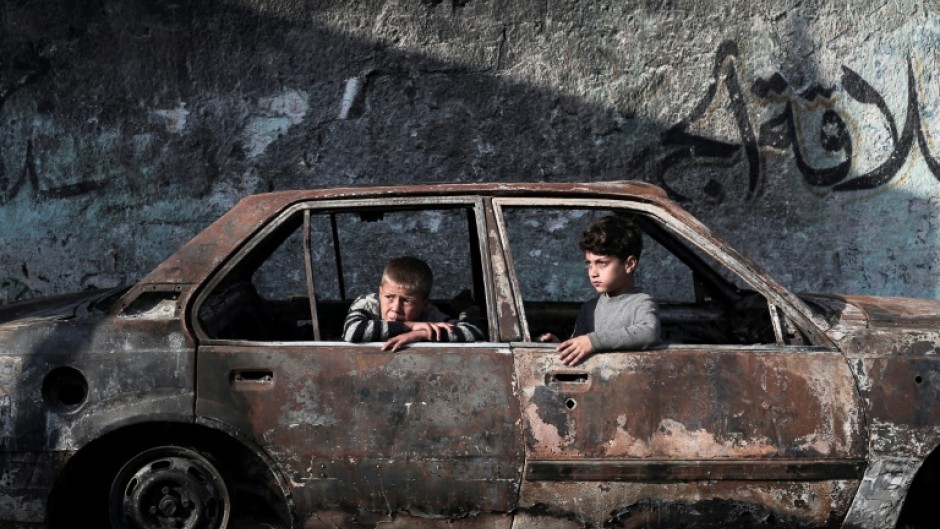 A destroyed car in Rafah, where Israeli strikes have occurred ahead of a mooted Israeli ground operation